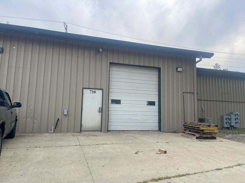 Rear overhead door and concrete apron