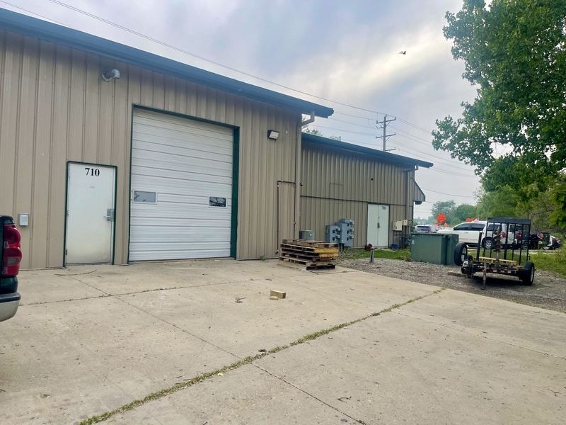 Rear entrance and overhead door, angled view