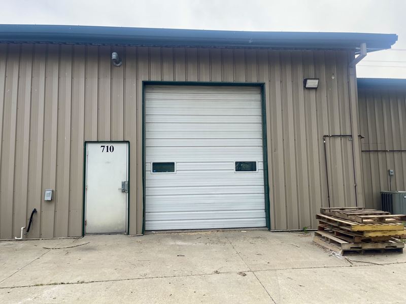 Rear of unit 710 showing the overhead door and service entrance